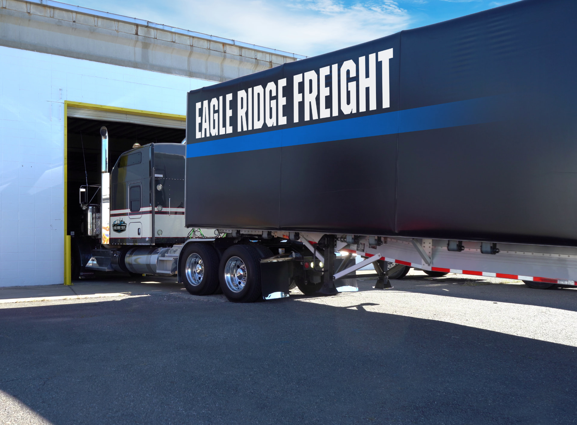 Flatbed truck hauling open-deck freight