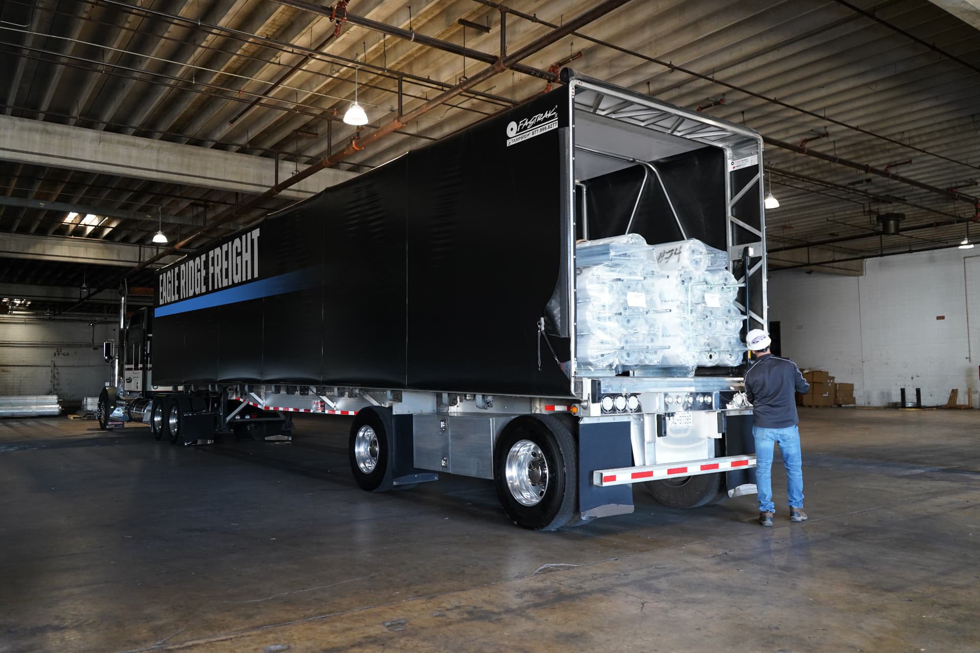 Eagle Ridge Freight specialist at the rear of a loaded trailer